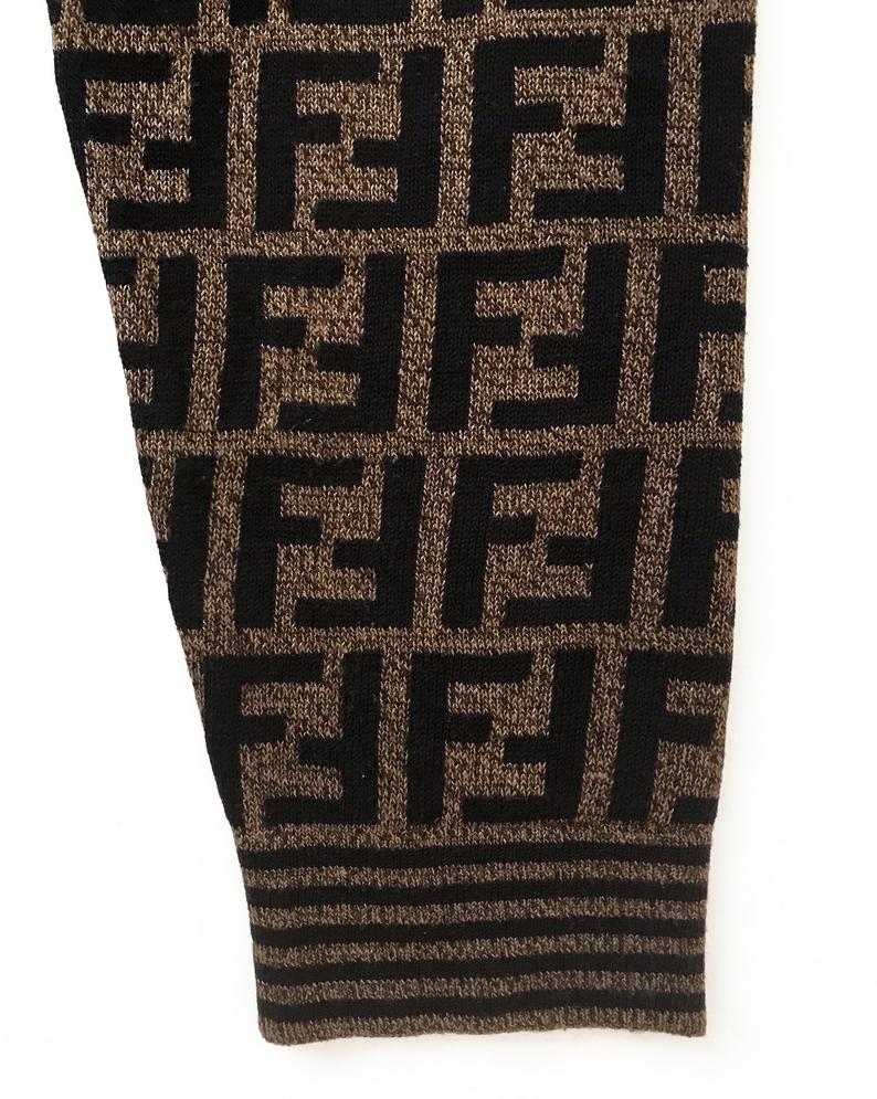 FRUIT vintage Fendi Zucca design sweater dating to the 1990s. This monogram knit features side splits and striped design on sleeves and neck. The logo is knitted into the jumper (intarsia style), the design is cut for a long-line, slightly oversized fit.