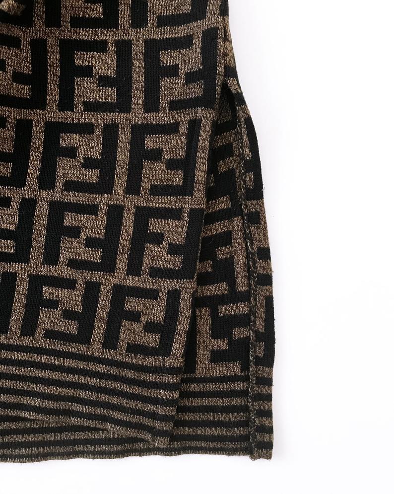 FRUIT vintage Fendi Zucca design sweater dating to the 1990s. This monogram knit features side splits and striped design on sleeves and neck. The logo is knitted into the jumper (intarsia style), the design is cut for a long-line, slightly oversized fit.