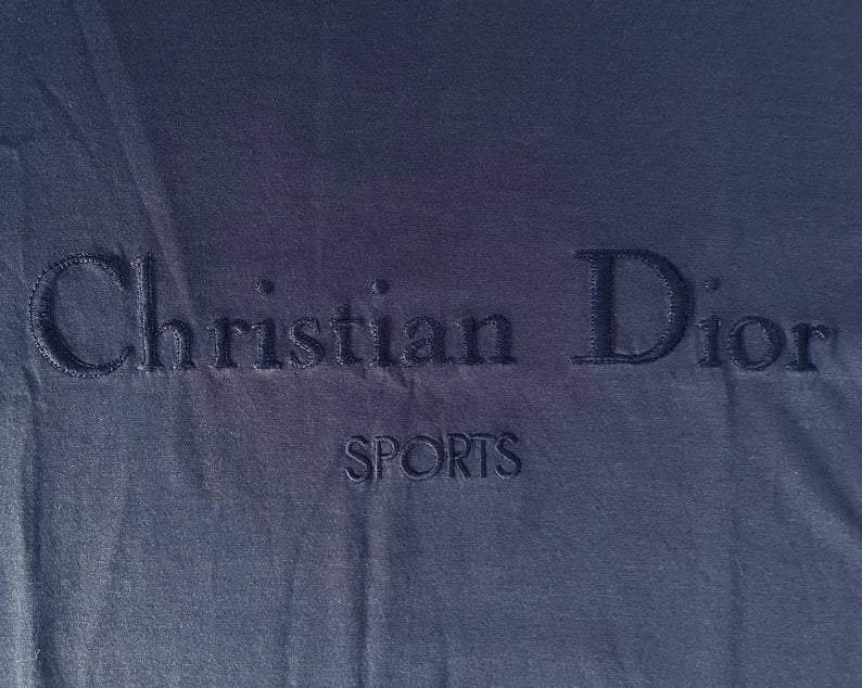 Fruit Vintage Christian Dior Sport Blue Logo 1980s t-shirt. It features a large embroidered logo design at front and slightly oversized cut.