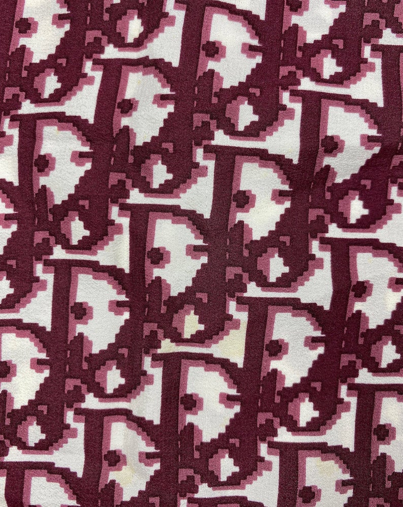 Fruit Vintage Christian Dior oblique print silk scarf, perfect for use as a hair accessory, to tie around a hat or even wear as a handkerchief top. Features a bold graphic Dior logo print and hand finished rolled hem edging.