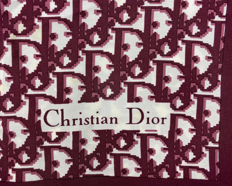 Fruit Vintage Christian Dior oblique print silk scarf, perfect for use as a hair accessory, to tie around a hat or even wear as a handkerchief top. Features a bold graphic Dior logo print and hand finished rolled hem edging.