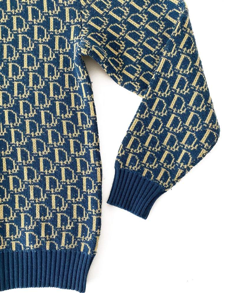 Fruit Vintage 1980s Christian Dior rare navy logo knit sweater. It features the iconic oblique print knitted into the weave of the fabric all over and a classic sweater cut.