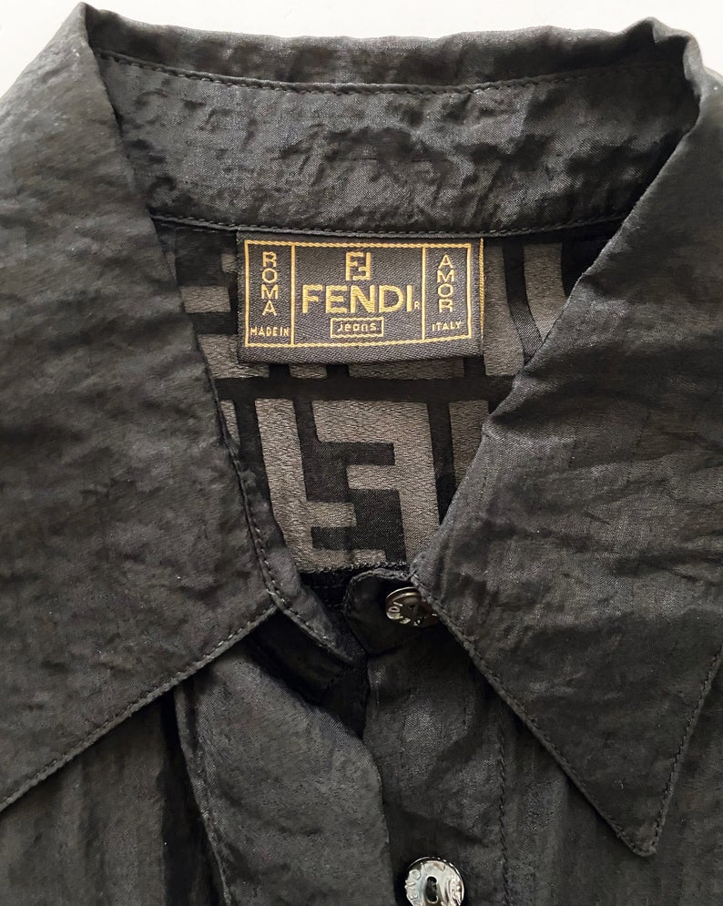 FRUIT vintage Fendi Zucca print button up shirt dating to the early 90s. This cute sheer variation of the classic Fendi Zucca print features a classic button up cut, and Fendi logo button closure.