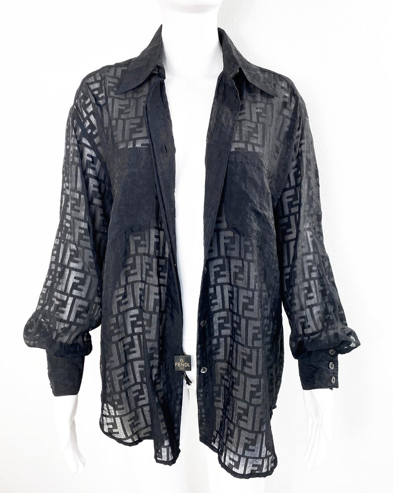 FRUIT vintage Fendi Zucca print button up shirt dating to the early 90s. This cute sheer variation of the classic Fendi Zucca print features a classic button up cut, and Fendi logo button closure.