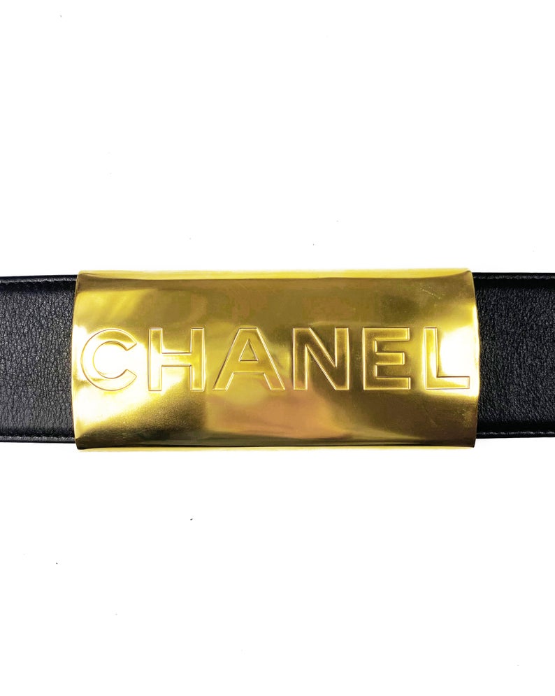 Fruit Vintage Chanel Logo Waist Belt dating to 1997. It features a very large gold bar with CHANEL logo at the front, internal logo foil stamp and date, and gold buckle at rear.
