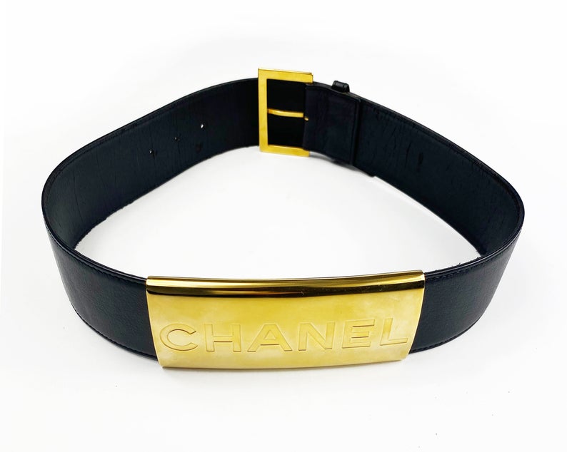 Fruit Vintage Chanel Logo Waist Belt dating to 1997. It features a very large gold bar with CHANEL logo at the front, internal logo foil stamp and date, and gold buckle at rear.
