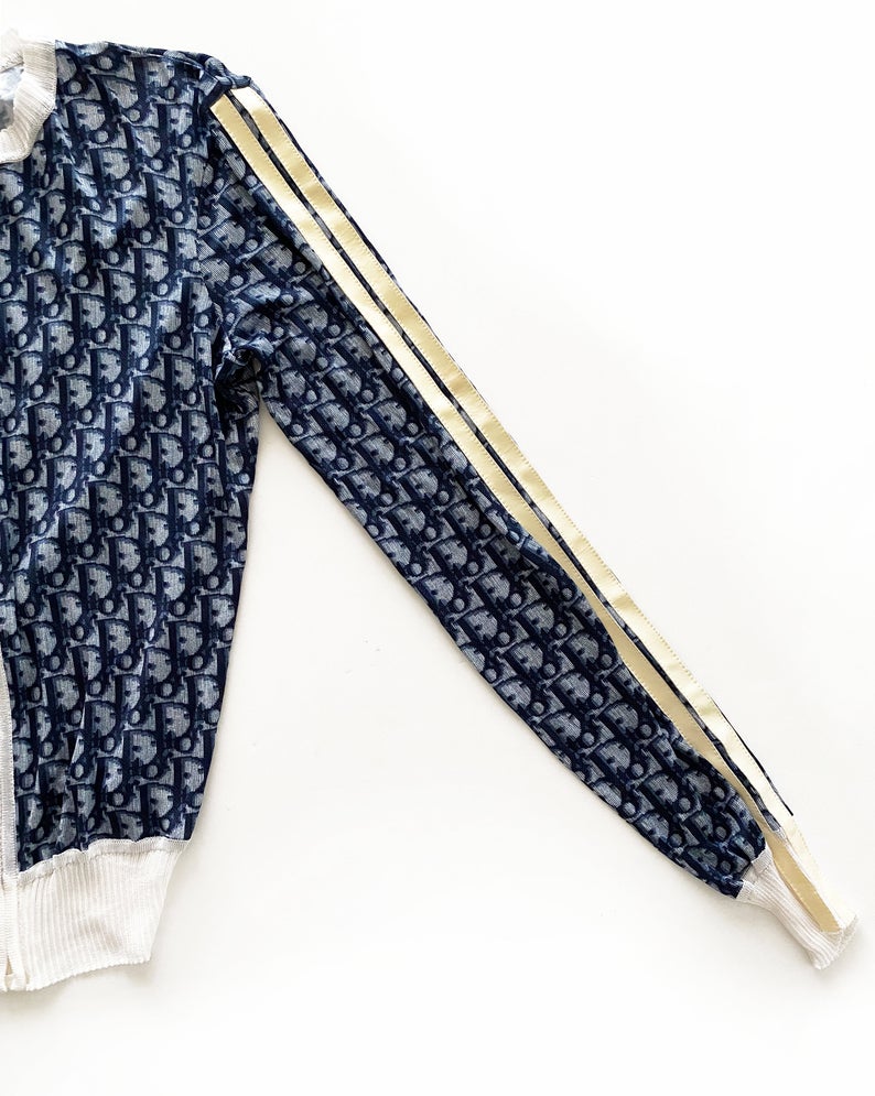 Fruit Vintage Christian Dior oblique logo zipper knit is about as iconic as it gets. Inspired by the original Dior trotter monogram canvas luggage and accessories, and re-released under the creative direction of John Galliano.