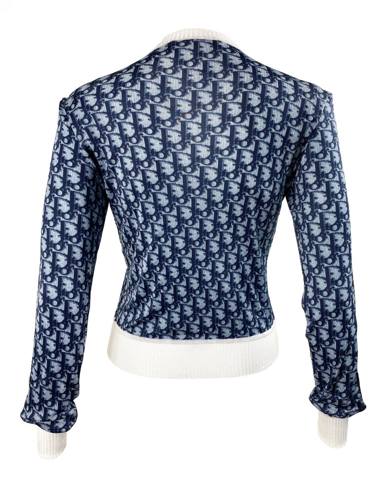Fruit Vintage Christian Dior oblique logo zipper knit is about as iconic as it gets. Inspired by the original Dior trotter monogram canvas luggage and accessories, and re-released under the creative direction of John Galliano.