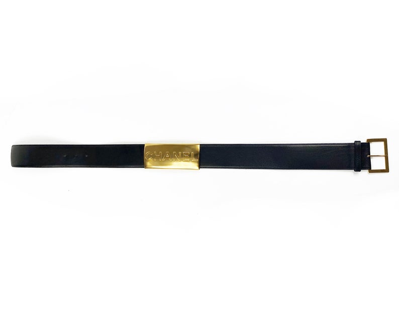 Fruit Vintage Chanel Logo Waist Belt dating to 1997. It features a very large gold bar with CHANEL logo at the front, internal logo foil stamp and date, and gold buckle at rear.