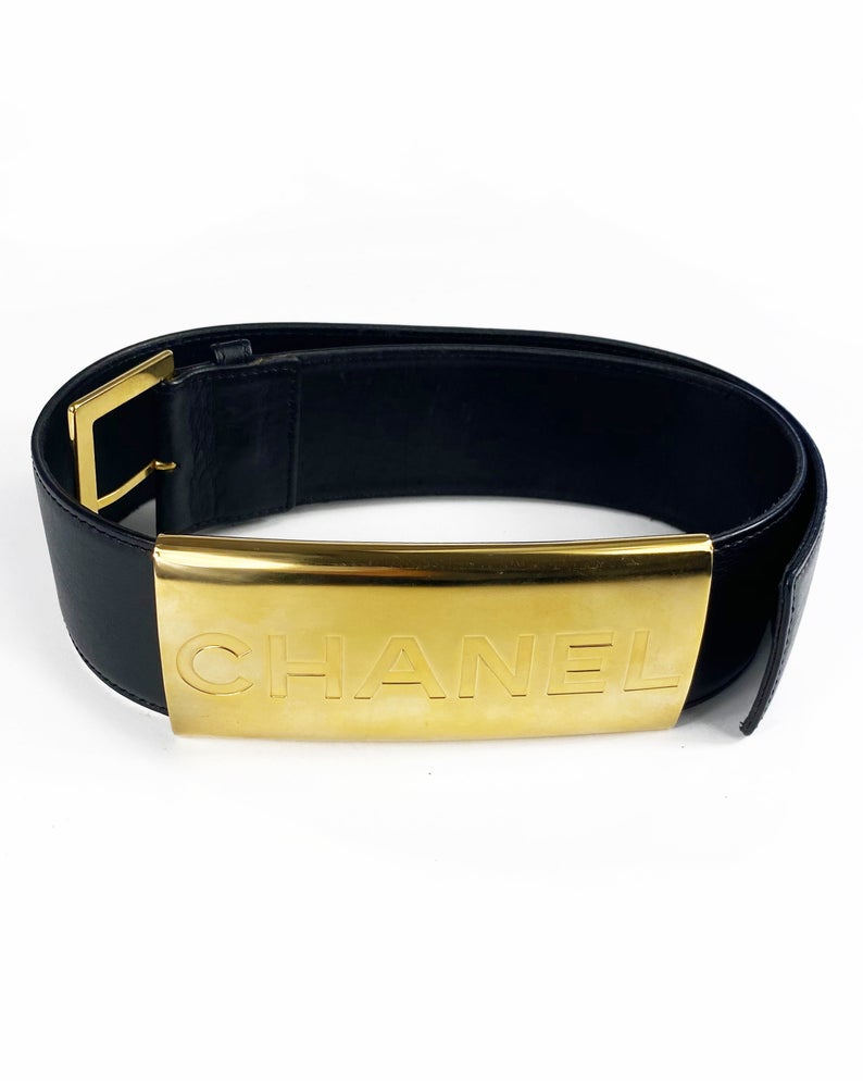 Fruit Vintage Chanel Logo Waist Belt dating to 1997. It features a very large gold bar with CHANEL logo at the front, internal logo foil stamp and date, and gold buckle at rear.