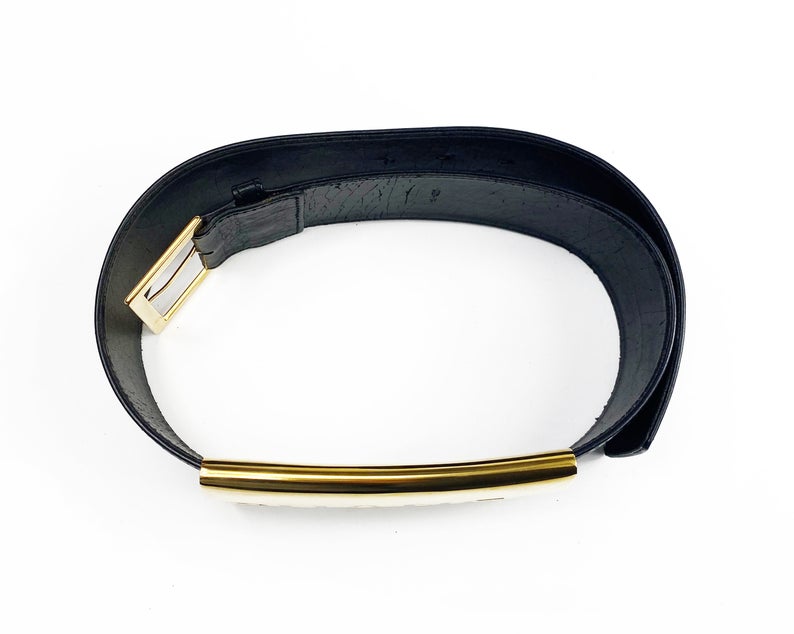 Fruit Vintage Chanel Logo Waist Belt dating to 1997. It features a very large gold bar with CHANEL logo at the front, internal logo foil stamp and date, and gold buckle at rear.