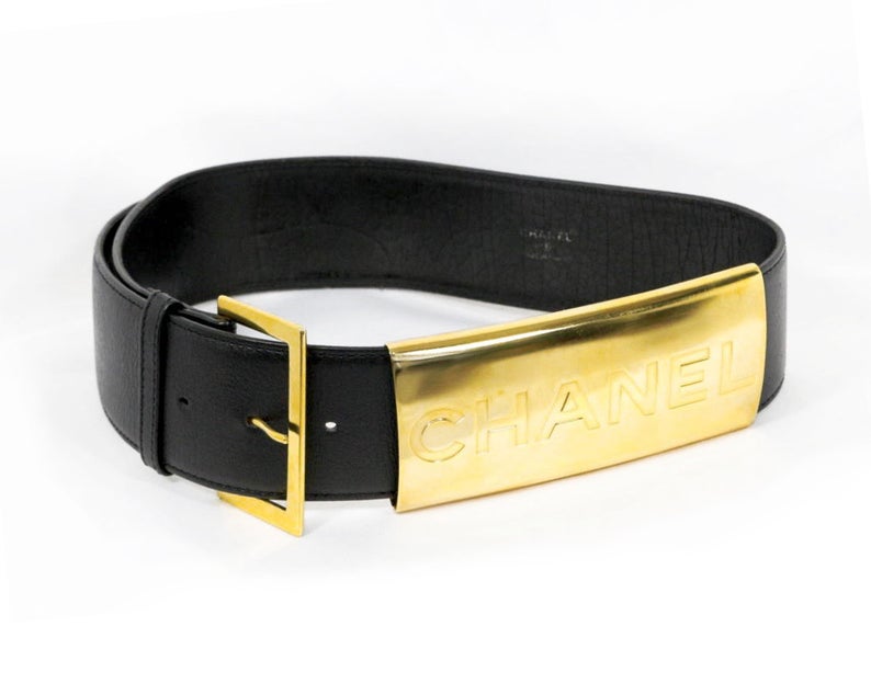 Fruit Vintage Chanel Logo Waist Belt dating to 1997. It features a very large gold bar with CHANEL logo at the front, internal logo foil stamp and date, and gold buckle at rear.