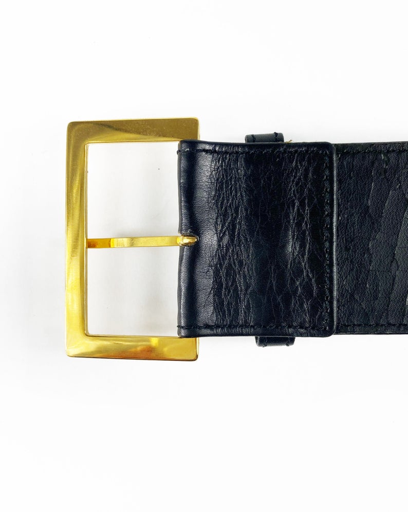 Fruit Vintage Chanel Logo Waist Belt dating to 1997. It features a very large gold bar with CHANEL logo at the front, internal logo foil stamp and date, and gold buckle at rear.