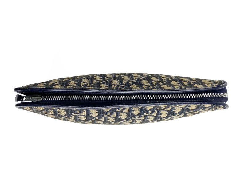 FRUIT Vintage Christian Dior 1980s navy trotter oblique monogram clutch bag. Features a classic pochette style shape with top zipper, internal pockets and vinyl lining.
