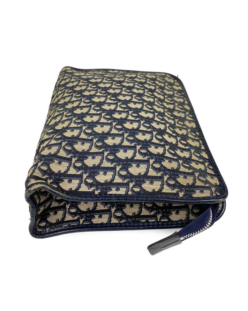 FRUIT Vintage Christian Dior 1980s navy trotter oblique monogram clutch bag. Features a classic pochette style shape with top zipper, internal pockets and vinyl lining.