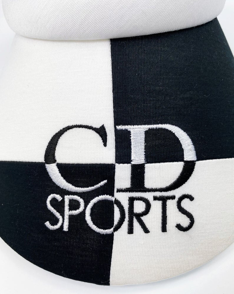 FRUIT Vintage Christian Dior Sport 1980s logo embroidered visor. Made from black and white jersey cotton it features a large CD Sport logo embroidered across the front. Comes with original tags!