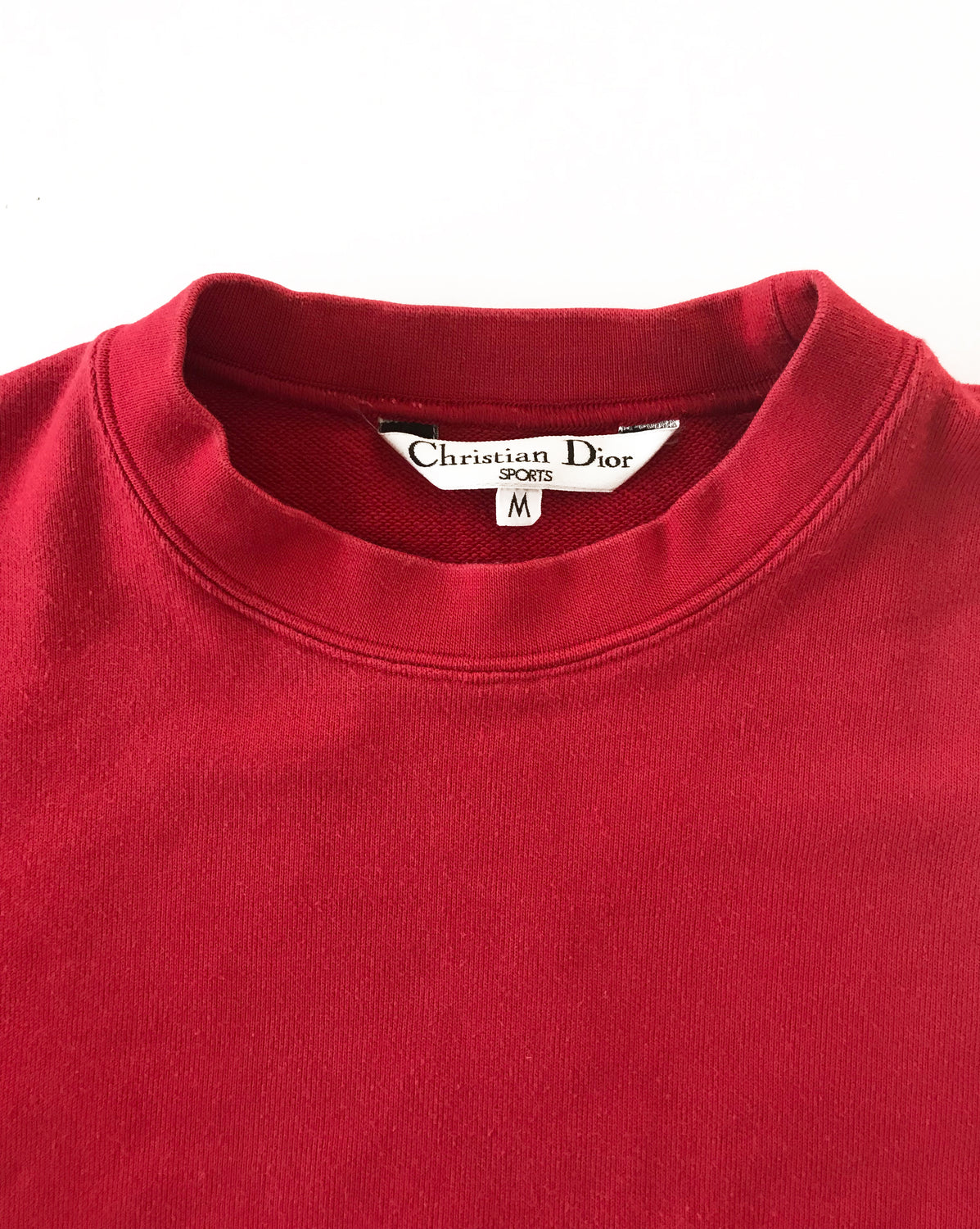 Fruit Vintage 1980s Christian Dior Sport Red Logo sweat shirt. It features a large embroidered logo design at front and classic sweat shirt cut.