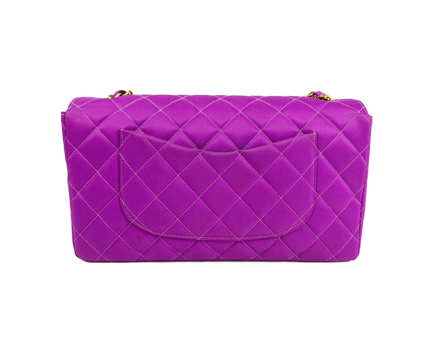 Fruit Vintage classic Chanel quilted nylon flap bag in extremely rare purple nylon, dating to 1995. Features the classic Chanel flap structure with contrast pale purple stitching and matte gold hardware.