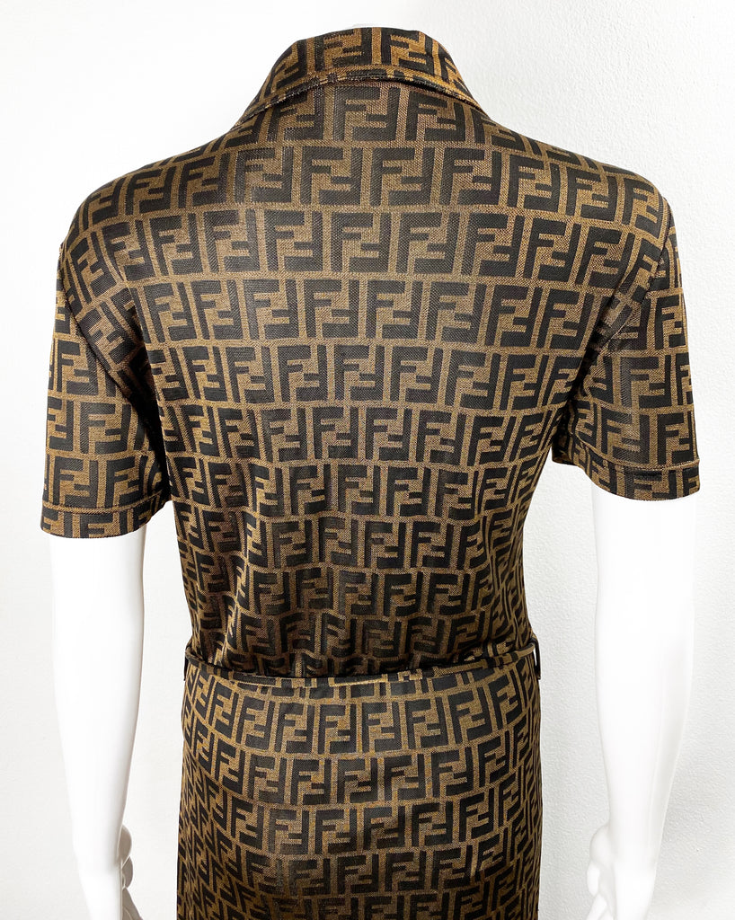 Fruit Vintage Fendi Zucca dress dating to the 90s it features a polo shirt dress cut, waist tie belt and a bold Fendi Zucca monogram logo print in black on brown.