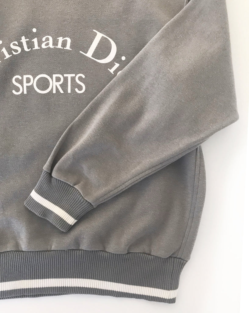 Fruit Vintage Christian Dior Sport Grey 1980s Logo sweat shirt. It features a large printed logo design at front and classic sweat shirt cut.