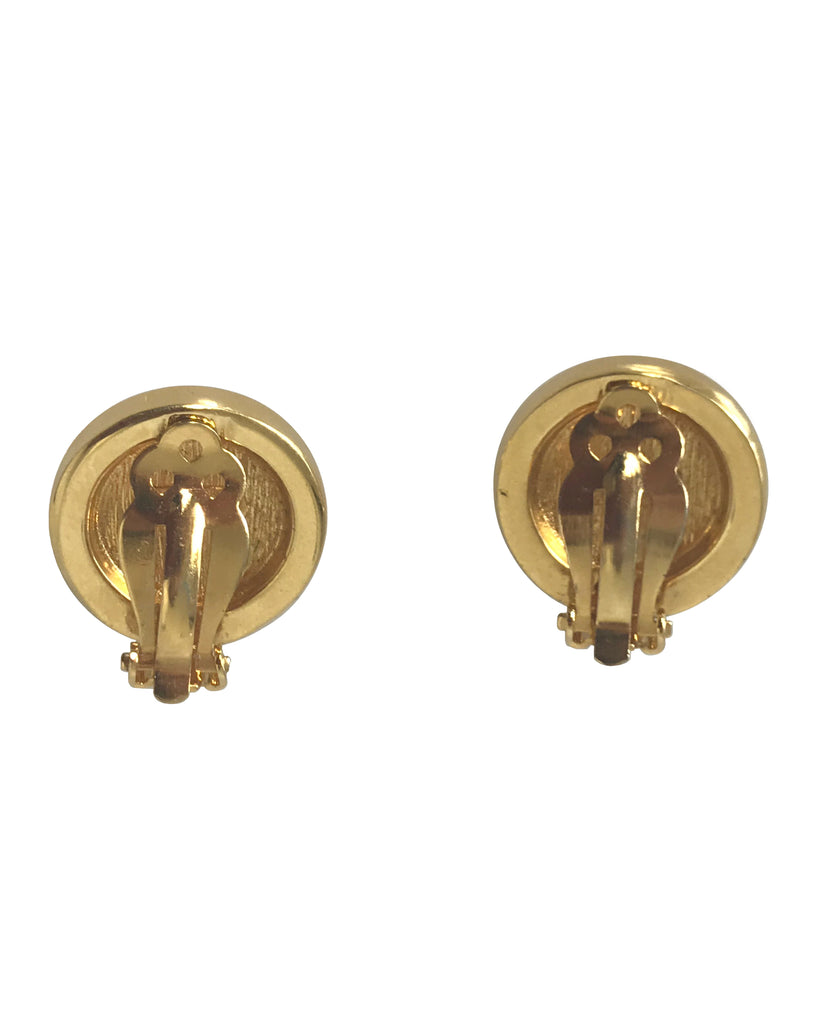Fruit Vintage Gianni Versace 1980s clip-on coin shaped earrings with small Medusa heads, surrounded by rhinestones.