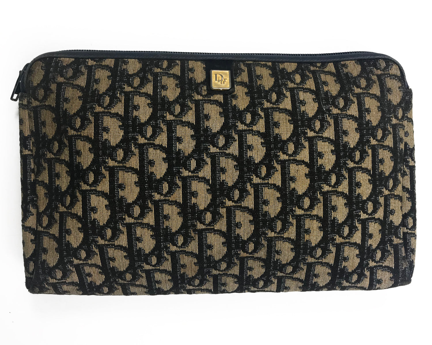 FRUIT Vintage Christian Dior 1980s navy trotter monogram clutch bag. Features a pochette style curved shape with top zipper and leather lining.
