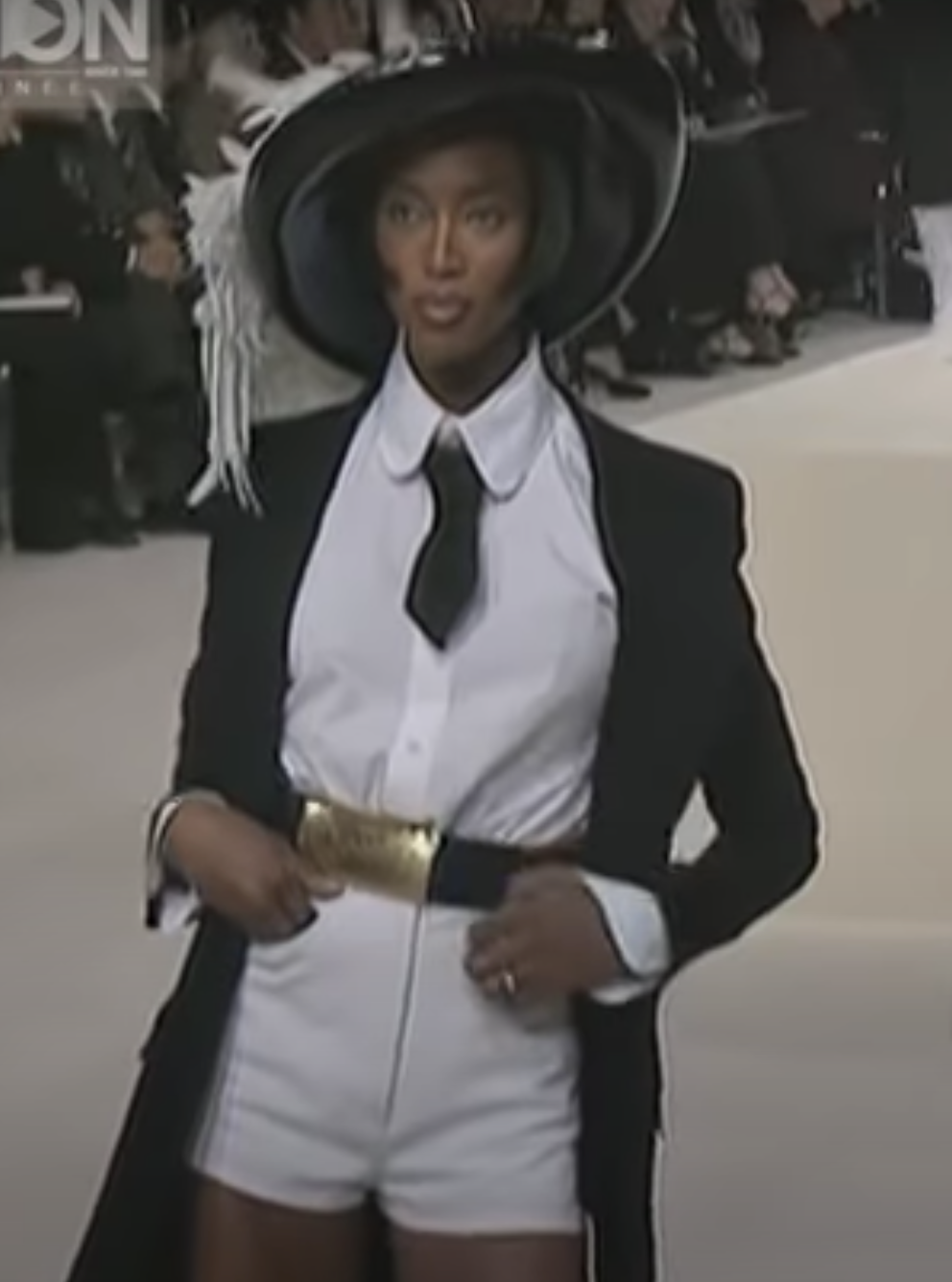 A rare, large Chanel Logo Waist Belt from 1997 -as worn on the runway by Naomi Campbell and Stella Tenant. It features a very large gold bar with CHANEL logo at the front, internal logo foil stamp and date, and gold buckle at rear. 