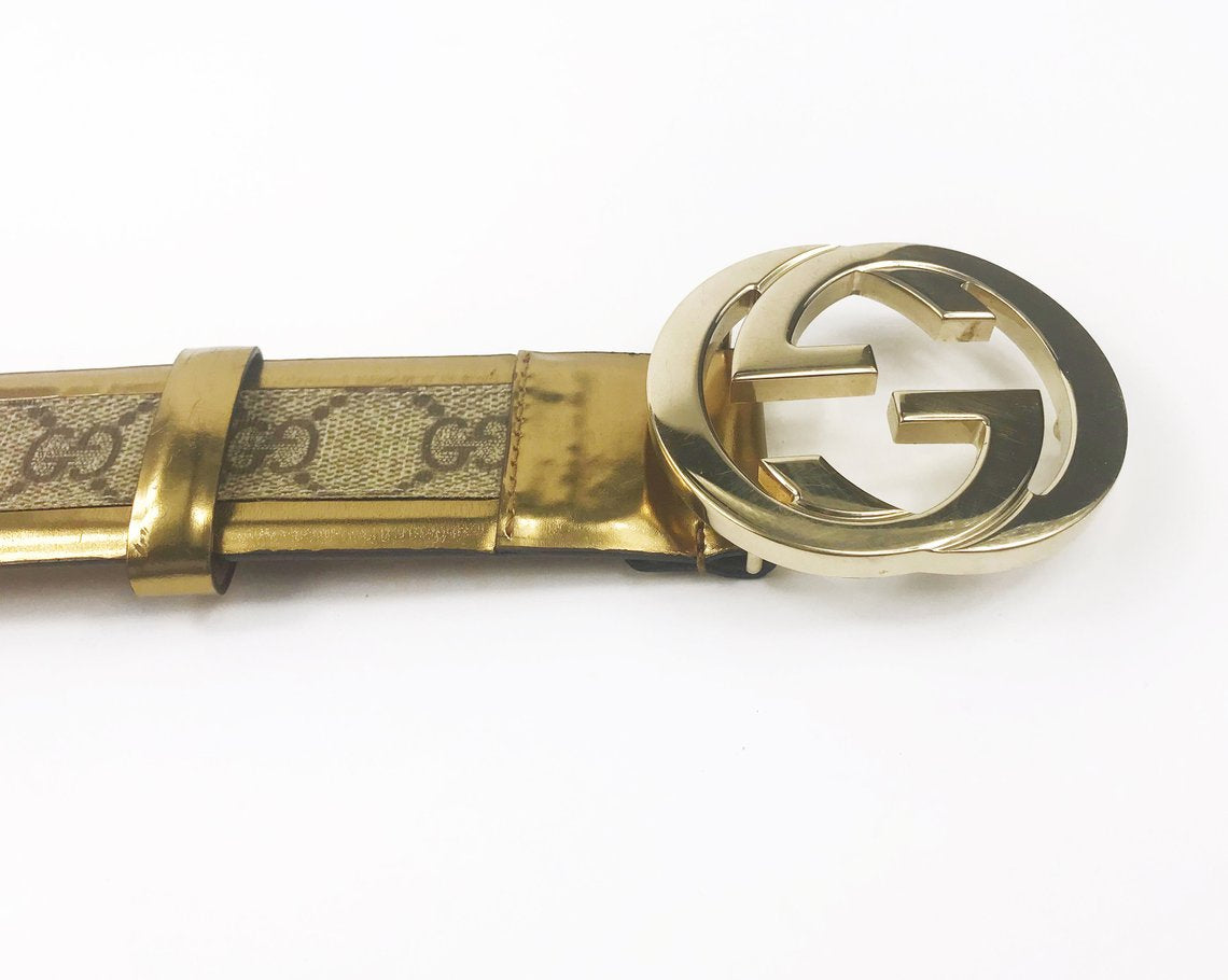 FRUIT Vintage Gucci 1990s logo belt featuring gold leather trim, classic Gucci coated canvas and a large Gucci double G buckle at the front.