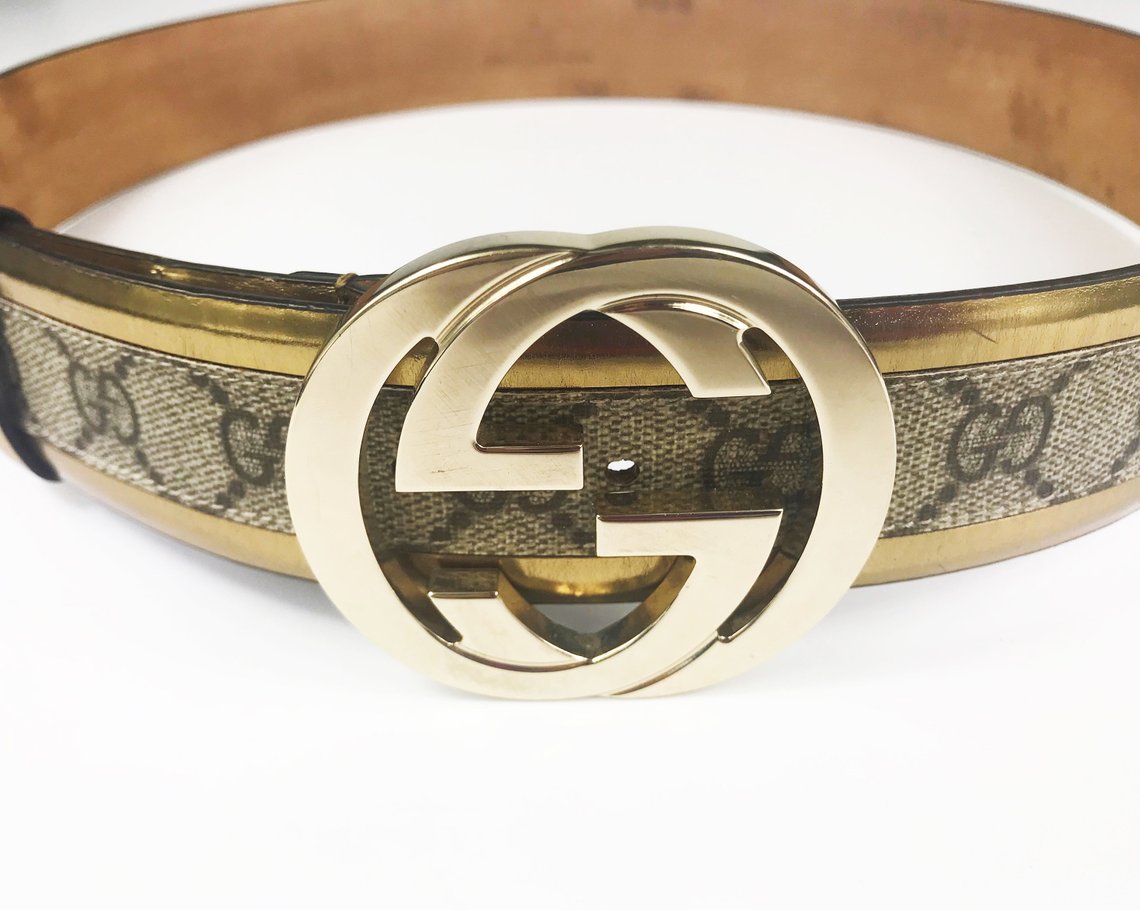 FRUIT Vintage Gucci 1990s logo belt featuring gold leather trim, classic Gucci coated canvas and a large Gucci double G buckle at the front.