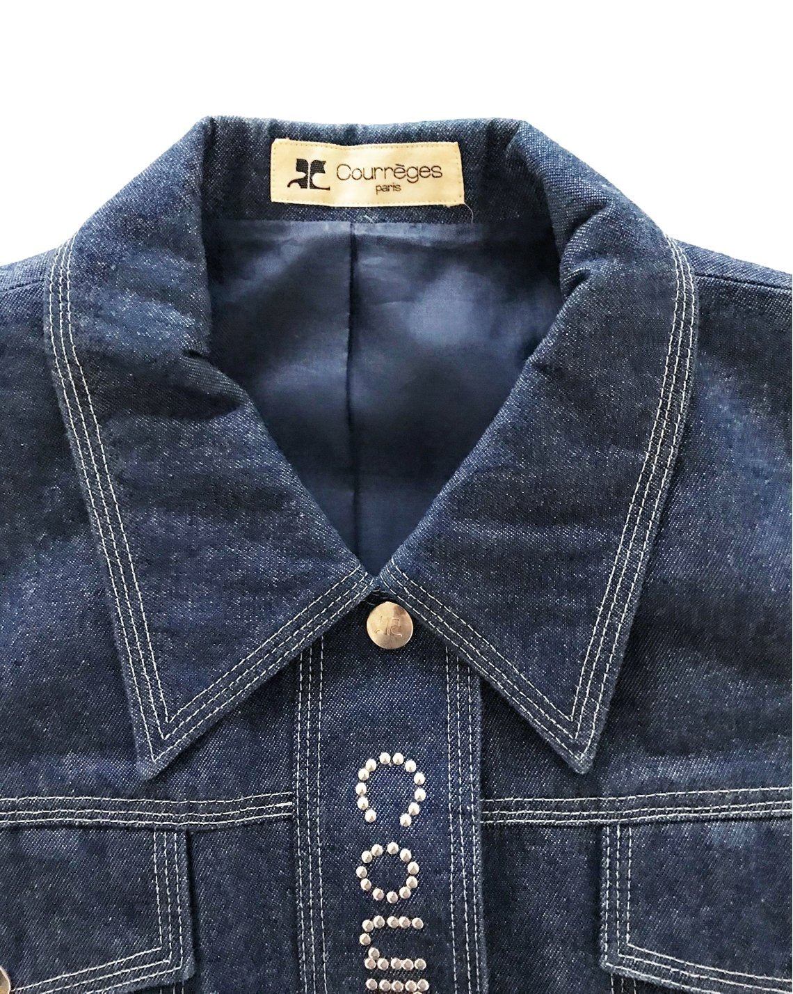 Fruit Vintage Courreges denim logo dress. Features a large silver logo at front, top stitching and logo buttons. Can also be fully unbuttoned and worn as coat/duster jacket.