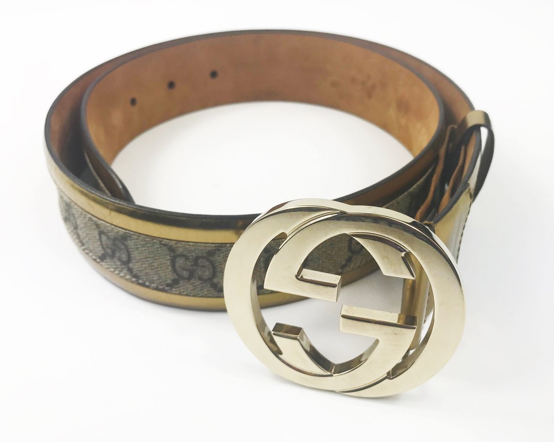 FRUIT Vintage Gucci 1990s logo belt featuring gold leather trim, classic Gucci coated canvas and a large Gucci double G buckle at the front.