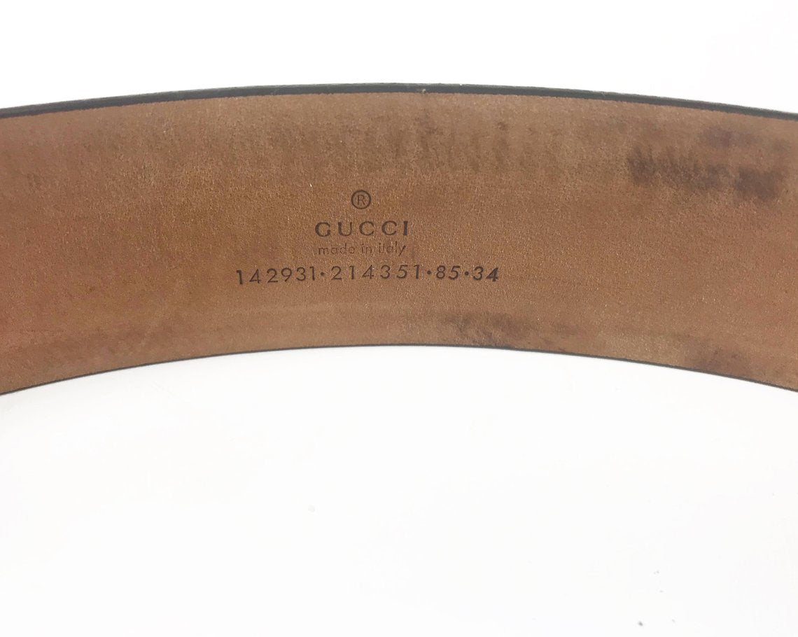 FRUIT Vintage Gucci 1990s logo belt featuring gold leather trim, classic Gucci coated canvas and a large Gucci double G buckle at the front.
