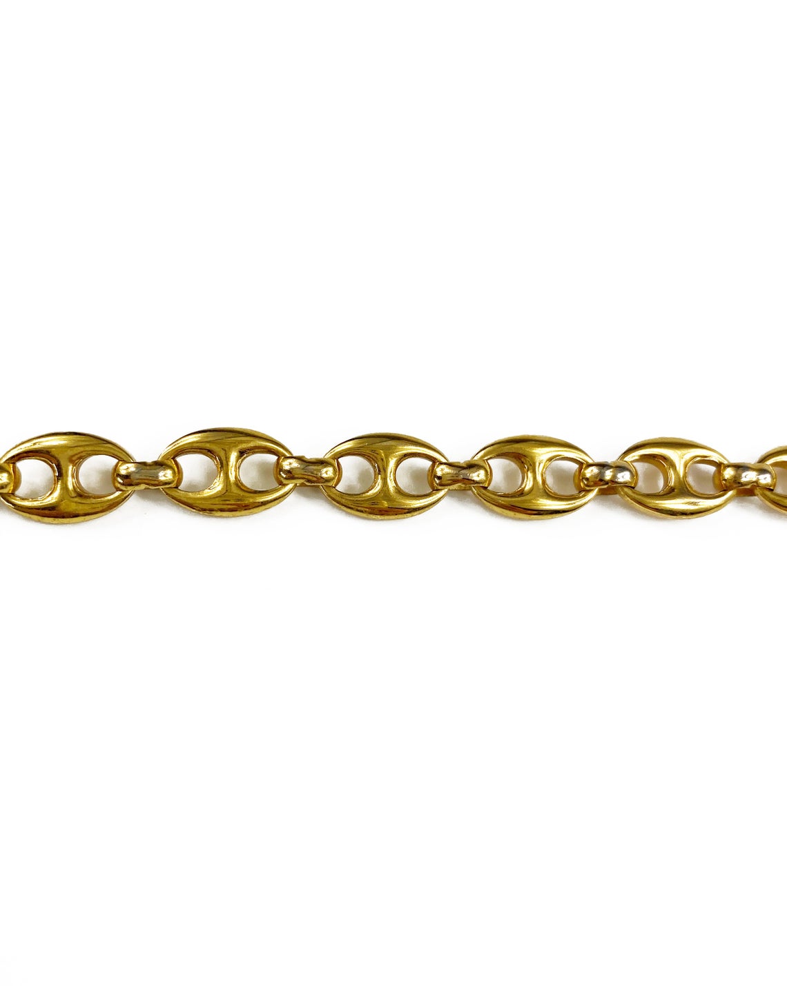 Fruit Vintage Gucci 1980s logo chain belt in classic gold. Features a lobster clip closure and significant logo drop Gucci GG charm. Looks incredible when worn as a necklace.