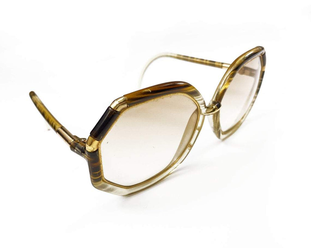 FRUIT Vintage iconic 1970s Ted Lapidus octagon oversized sunglasses in a brown and gold colour way. Made in France, they feature brown smokey lenses and a gold metal trim.