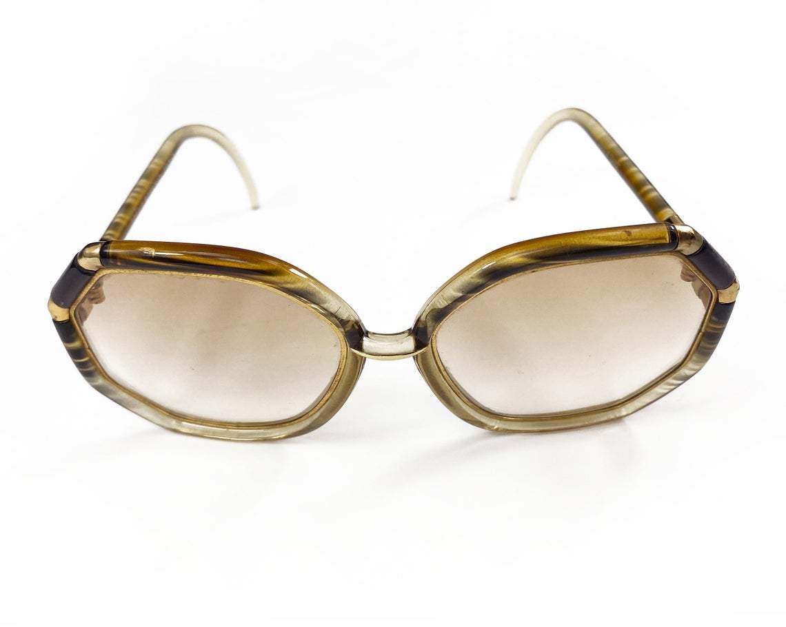 FRUIT Vintage iconic 1970s Ted Lapidus octagon oversized sunglasses in a brown and gold colour way. Made in France, they feature brown smokey lenses and a gold metal trim.