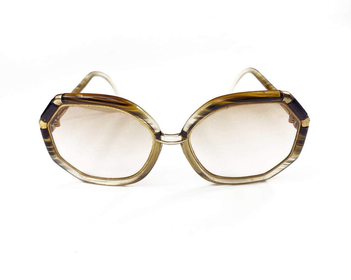 FRUIT Vintage iconic 1970s Ted Lapidus octagon oversized sunglasses in a brown and gold colour way. Made in France, they feature brown smokey lenses and a gold metal trim.