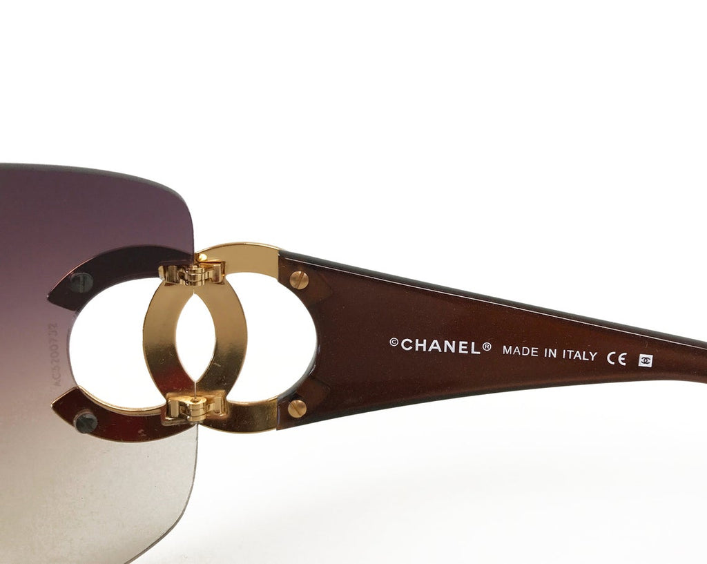 Fruit Vintage Chanel large Y2K logo sunglasses. They feature big Chanel CC logo monograms to each side and a classic early 2000s shield shape.