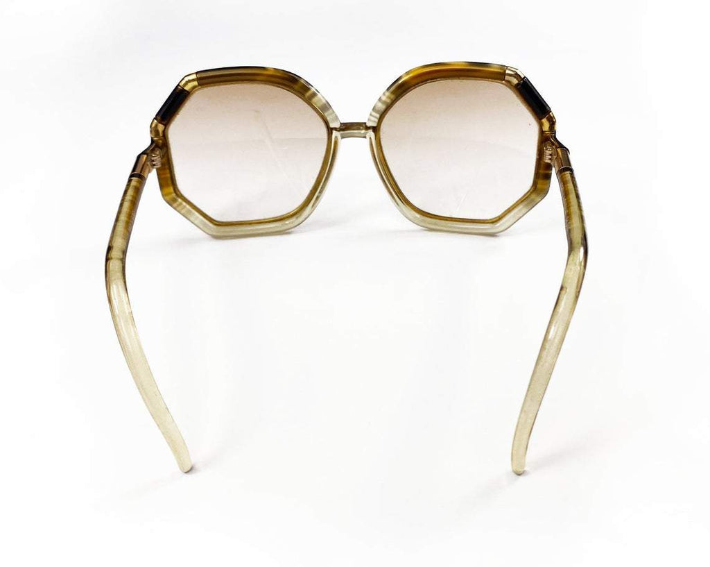 FRUIT Vintage iconic 1970s Ted Lapidus octagon oversized sunglasses in a brown and gold colour way. Made in France, they feature brown smokey lenses and a gold metal trim.