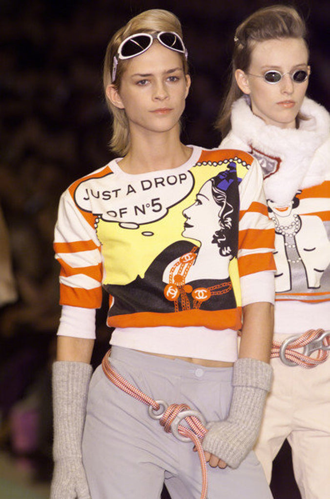 FRUIT Vintage rare and important Chanel "Just a Drop of No. 5" sweatshirt from the Fall 2001 collection. It features a pop art Roy Lichtenstein inspired graphic art print of Coco Chanel and a cropped design and sleeves.