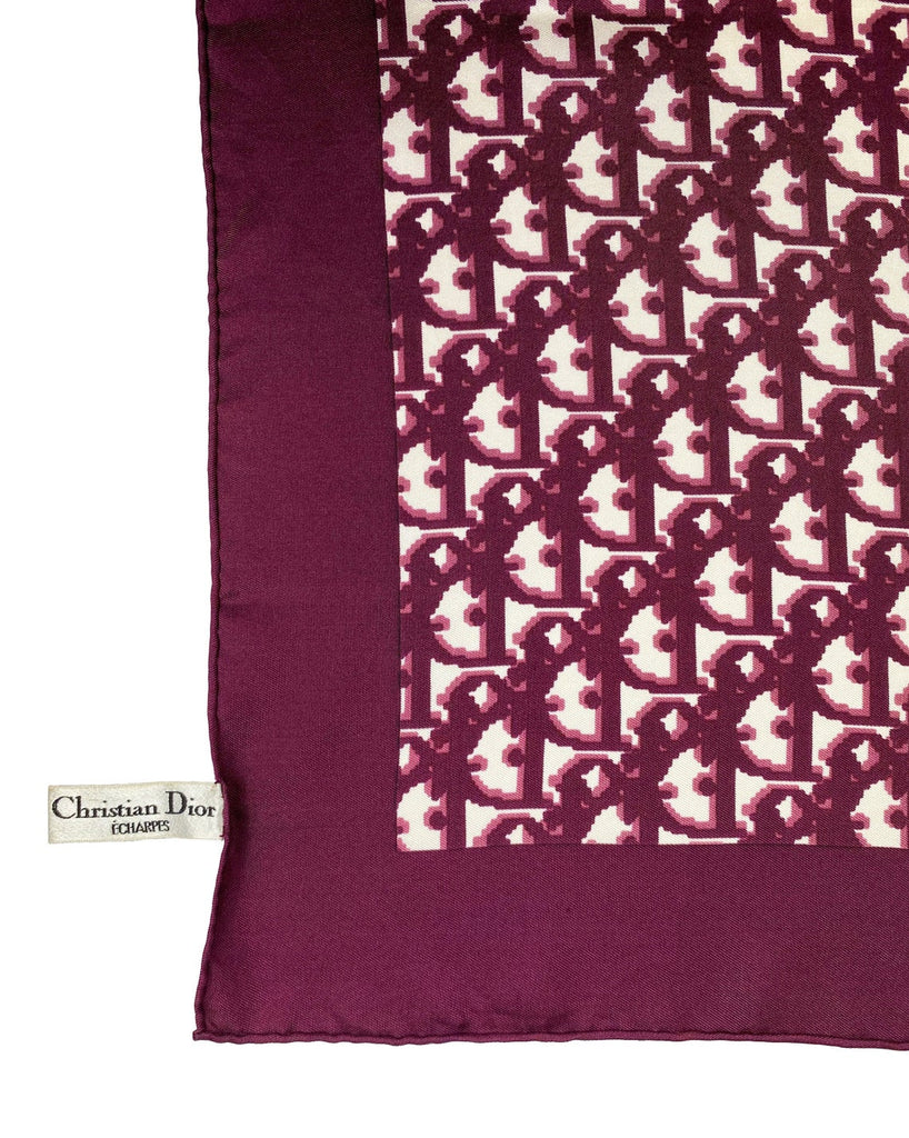 Fruit Vintage Christian Dior oblique print silk scarf in deep red/maroon. Features a bold graphic Dior logo print and hand finished rolled hem edging.