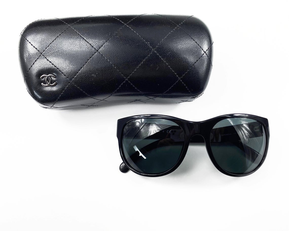 Fruit Vintage classic Chanel black logo sunglasses. They feature Chanel CC logo monograms to each side made from silver mirror.