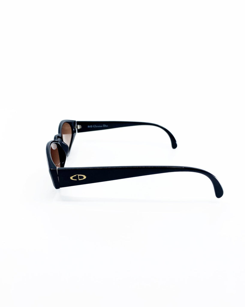 Fruit Vintage Christian Dior sunglasses dating to 1990. These small oval frames feature a gold trim over the nose and CD logo to each arm.