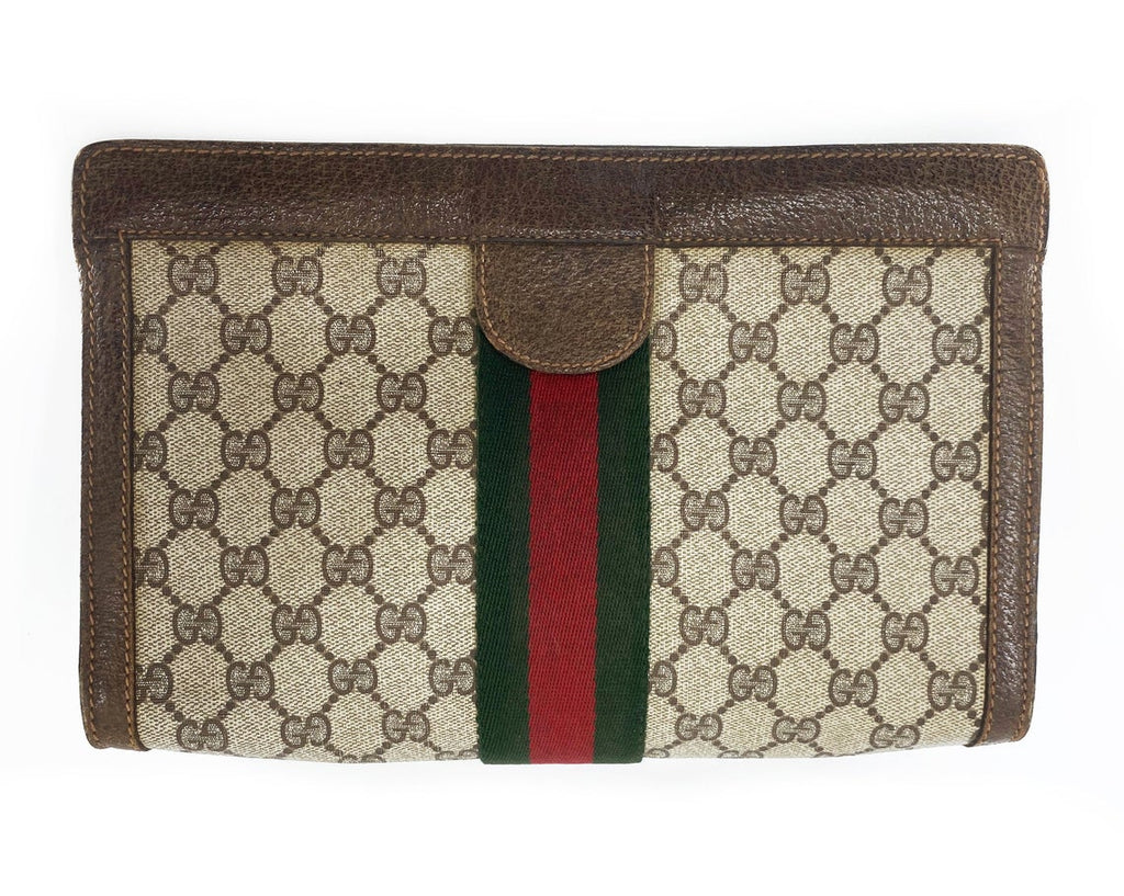 FRUIT Vintage Gucci 1980s Logo monogram canvas clutch bag. It features the iconic Gucci logo coated canvas, green and red fabric stripe, and velcro top closure.