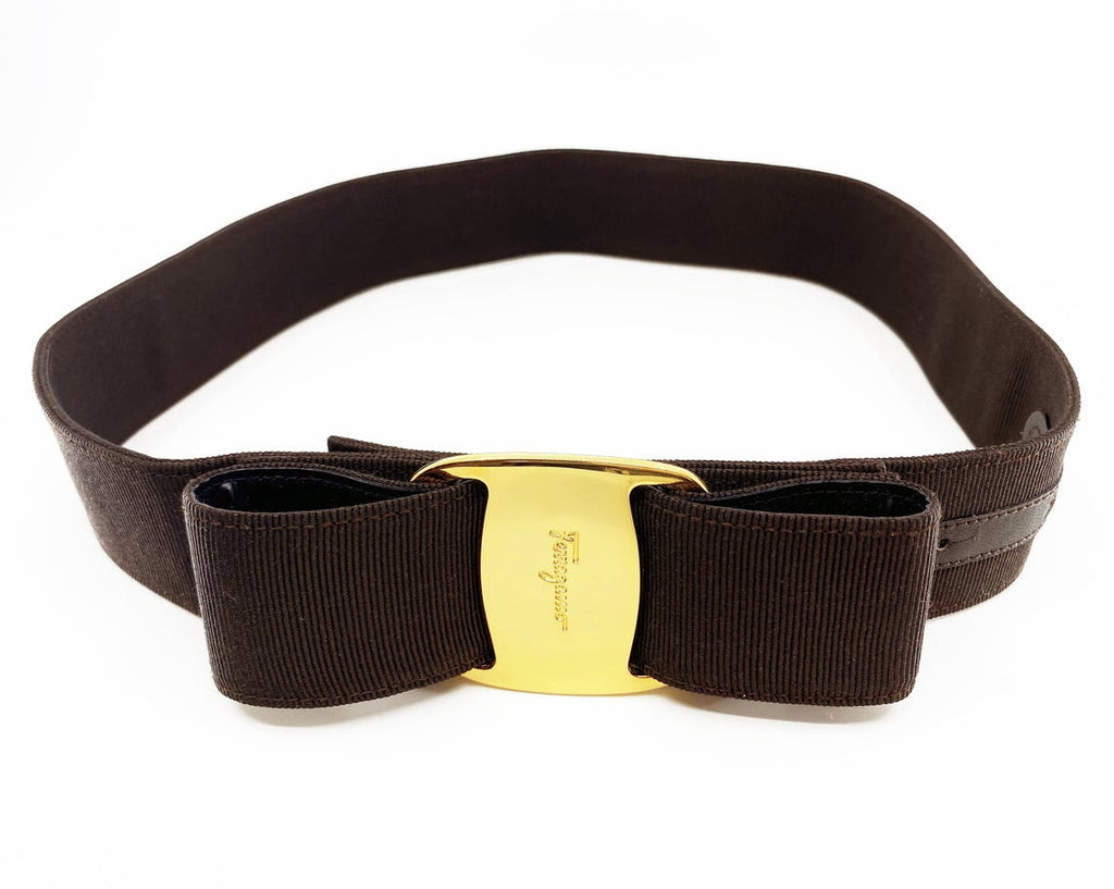 Fruit Vintage Salvatore Ferragamo 1980s bow belt in dark brown gross grain fabric. It features the iconic Ferragamo bow design with a large logo plate at front.