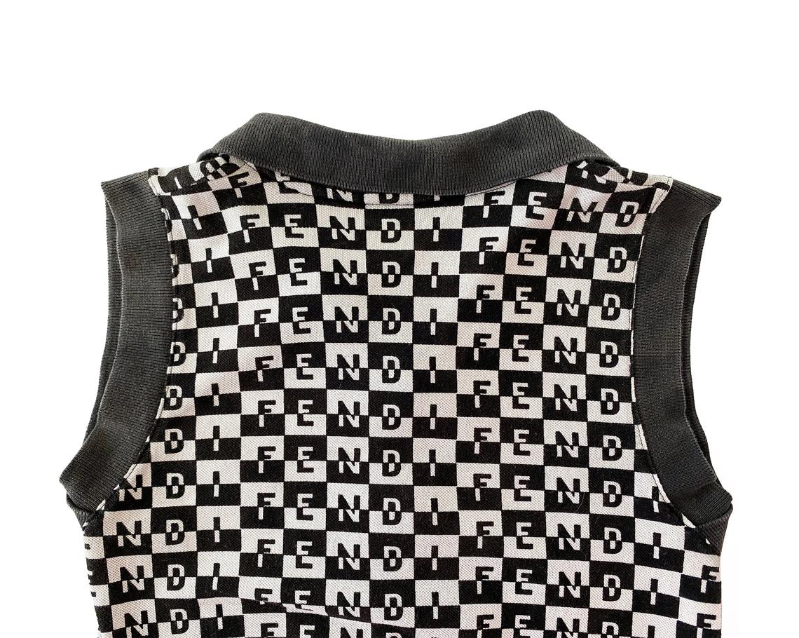 Fruit Vintage Fendi logo dress dating to the 90s, it features a polo shirt dress cut and a bold Fendi Logo print in black and white.