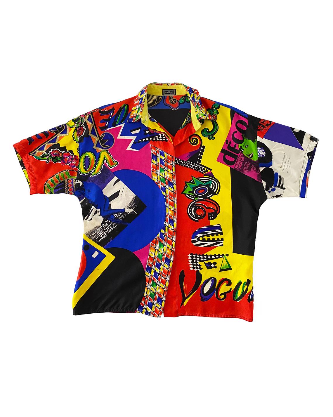 FRUIT Vintage Gianni Versace Vogue print silk short sleeve shirt from the Spring 1991 collection (as worn by Christy Turlington on the Runway). It features the iconic Vogue print in large scale all over and gold feature button on collar.
