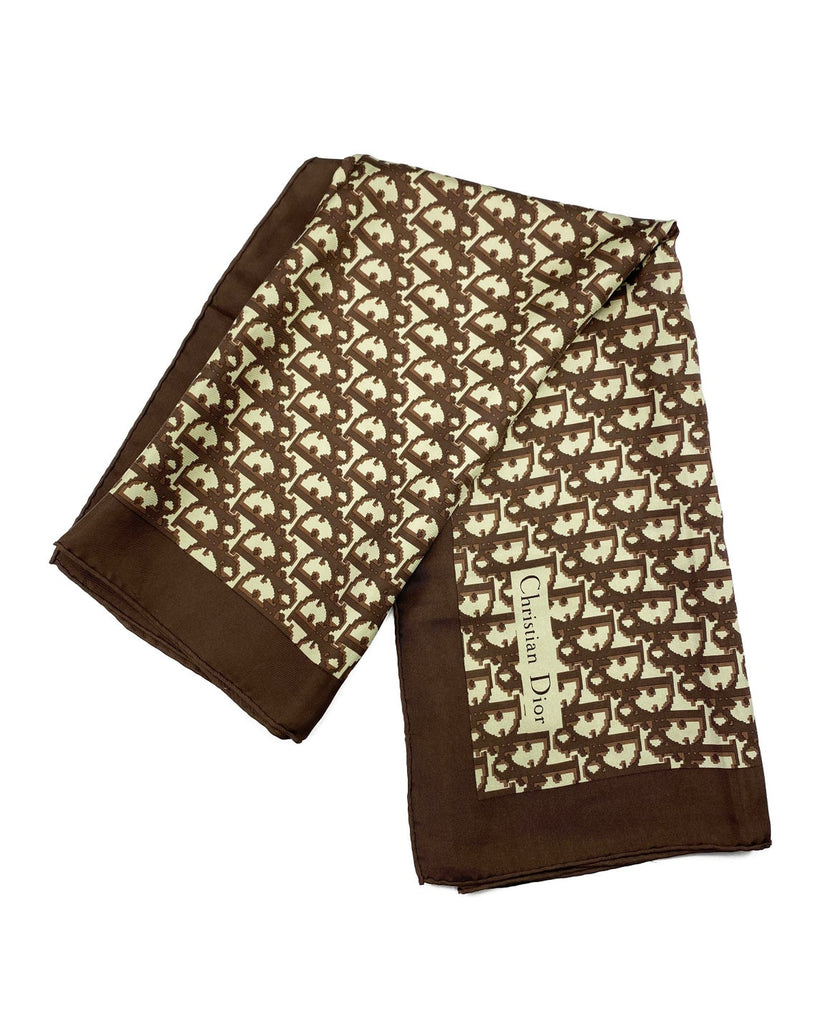 Fruit Vintage Christian Dior oblique print silk scarf in brown. Features a bold graphic Dior logo print and hand finished rolled hem edging.