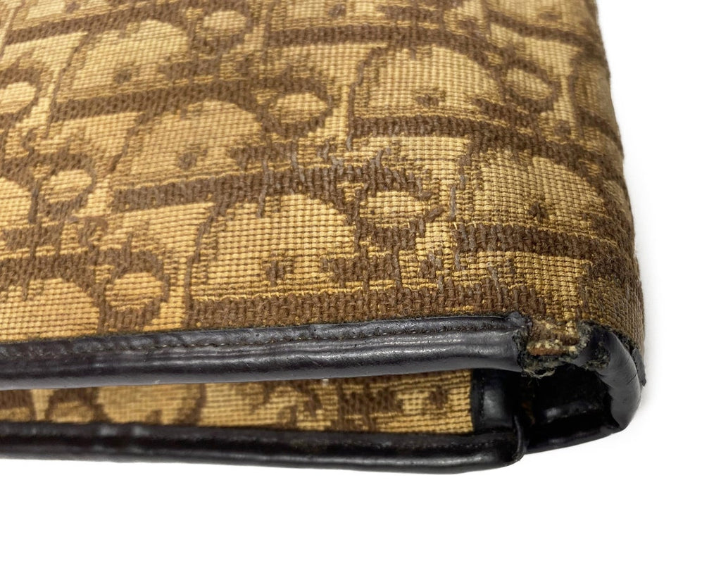 FRUIT Vintage 1970s Christian Dior brown canvas trotter monogram clutch bag. Features a pochette/soft brief case style shape with front clip closure with key and full leather lining. Perfect as a laptop case or document holder!