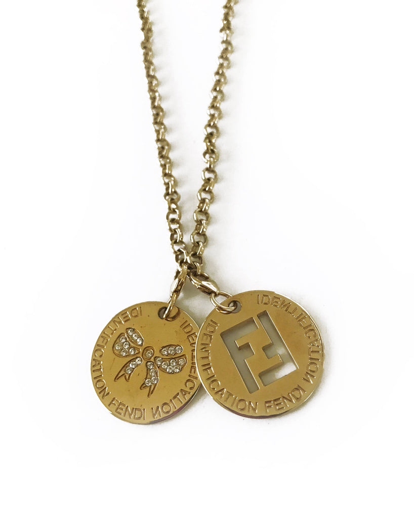 FRUIT Vintage Fendi zucca logo charm necklace in excellent condition. Features 2 removable charm pendants, one with cut-out Fendi logo F's and a second with crystal embellished bow symbol