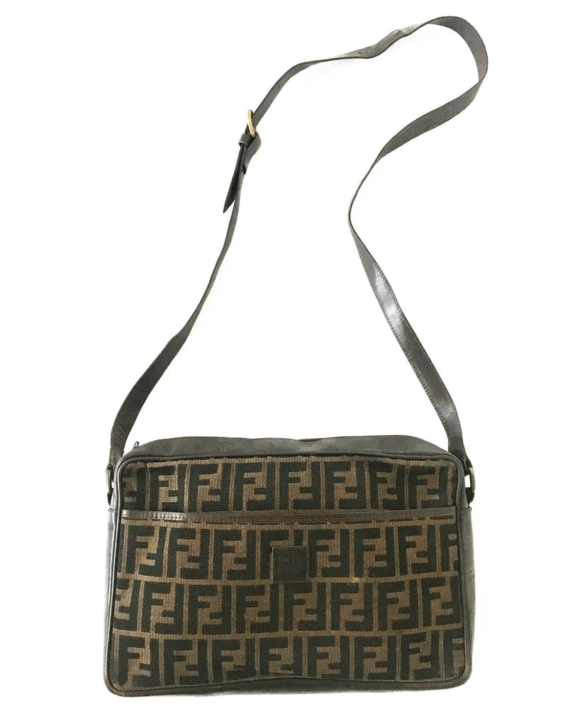 FRUIT Vintage Fendi Zucca cross body satchel handbag dating to the 1980s. It features the classic Fendi Zucca monogram canvas, front embossed logo, top zipper closure and long adjustable cross body strap bag.